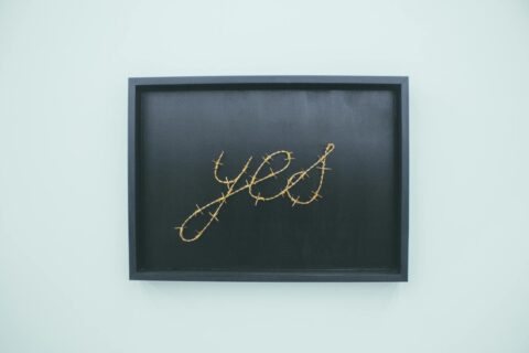 yes signage on brown wooden chalkboard